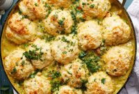 Dutch Oven Chicken Pot Pie with Flaky Biscuit Topping