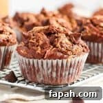 Close up on a muffin over a cooling rack.