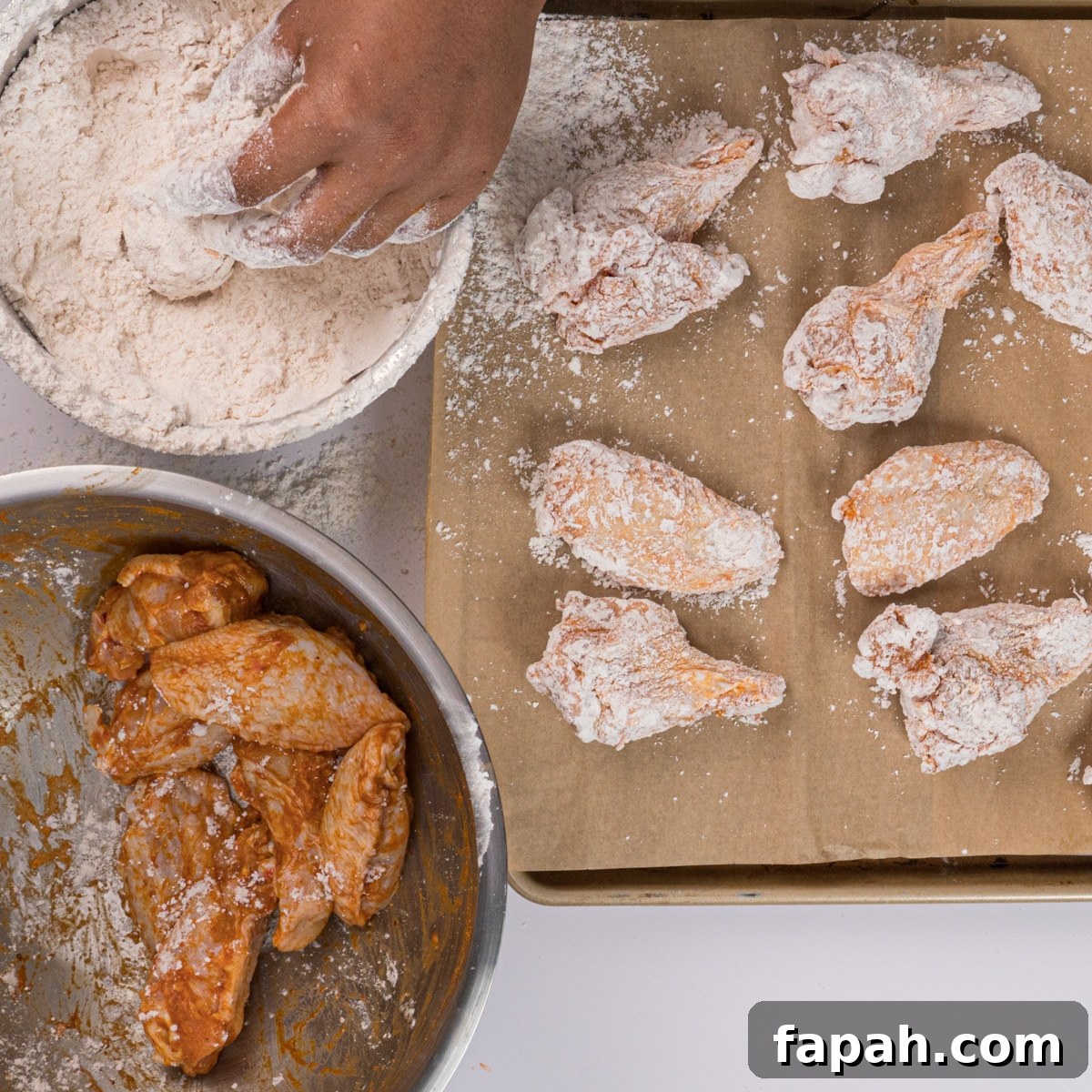 Crispy Lemon Pepper Chicken Wings Recipe 4 Wings being coated in flour