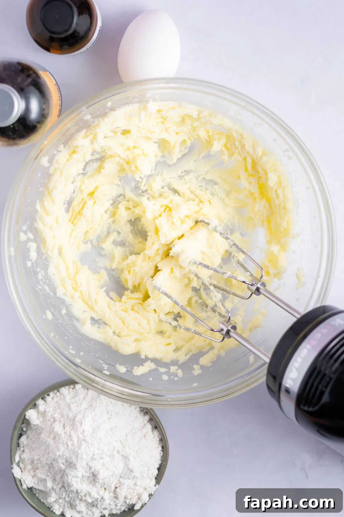 Sugar Cookie Cake Recipe: Soft, Chewy Layer Cake Guide 5 creamed butter and salt in a bowl with a hand mixer
