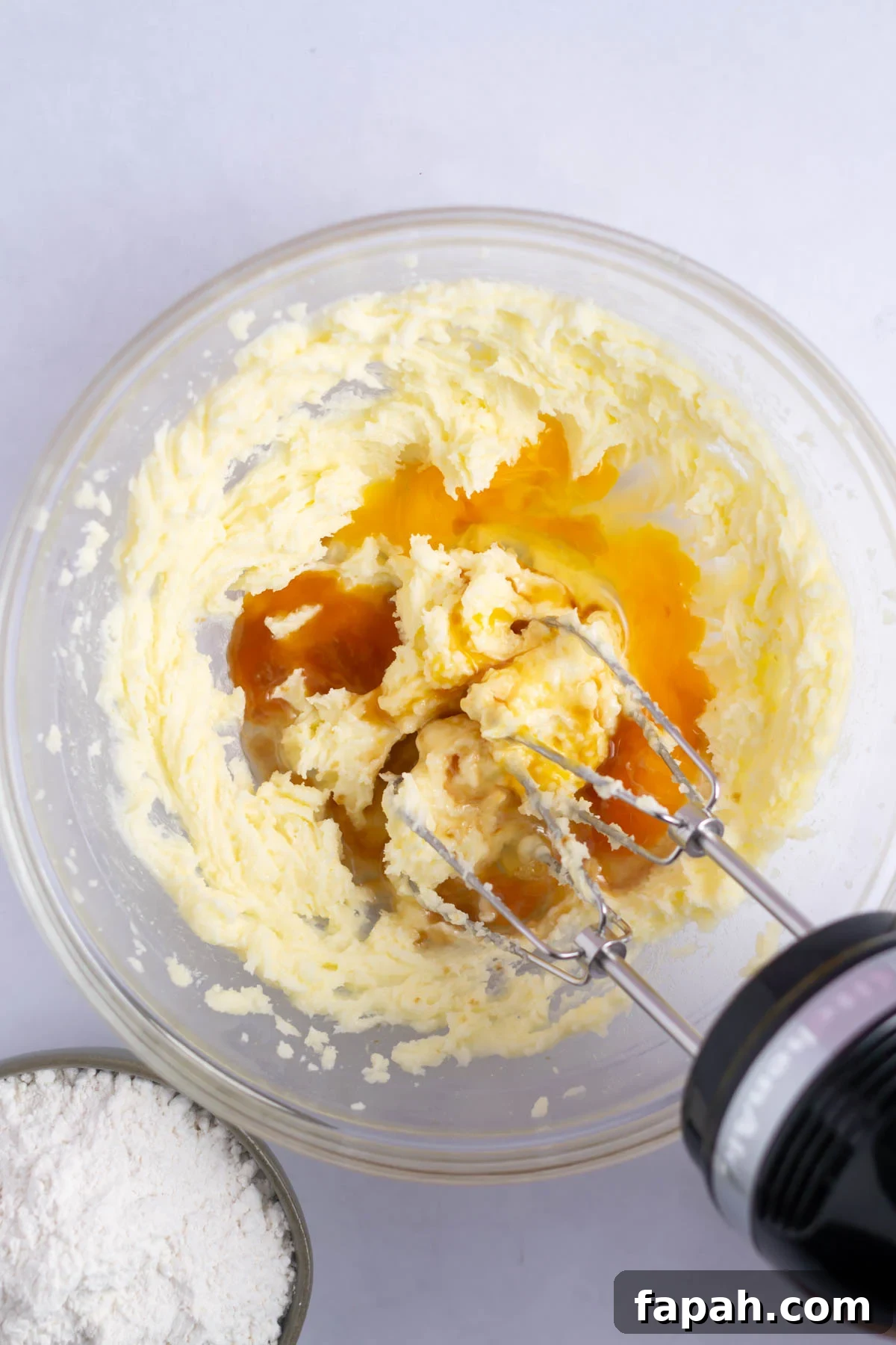 Sugar Cookie Cake Recipe: Soft, Chewy Layer Cake Guide 6 egg and vanilla added to creamed butter and sugar in a bowl