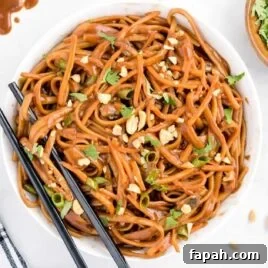 Low-Carb Cauliflower Fried Rice Recipe for Quick Weeknight Meals 7 overhead shot of a bowl of Thai Noodles garnished with cilantro