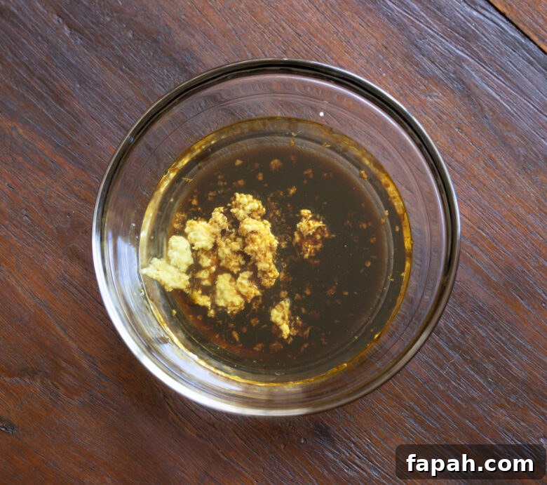 Ginger and soy sauce together to be whisked.