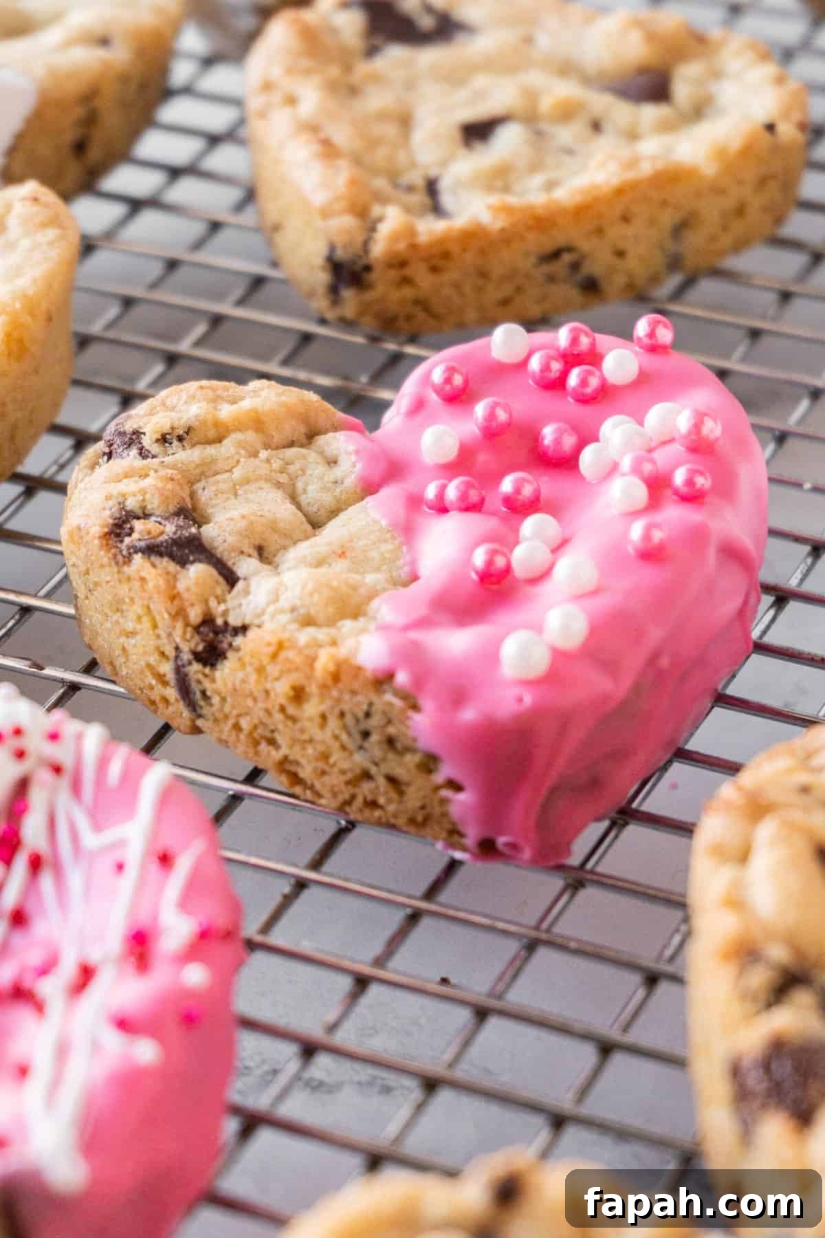 Heart-Shaped Cookies Recipe for Valentine’s Day 2 heart shaped chocolate chip cookies on cooling rack some decorated