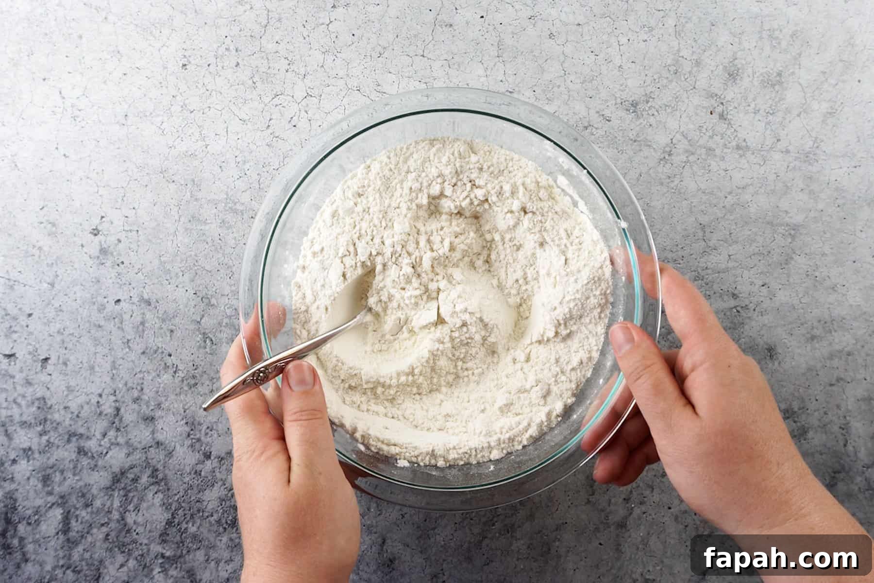 Heart-Shaped Cookies Recipe for Valentine’s Day 4 flour mixture for cookie dough in glass bowl.