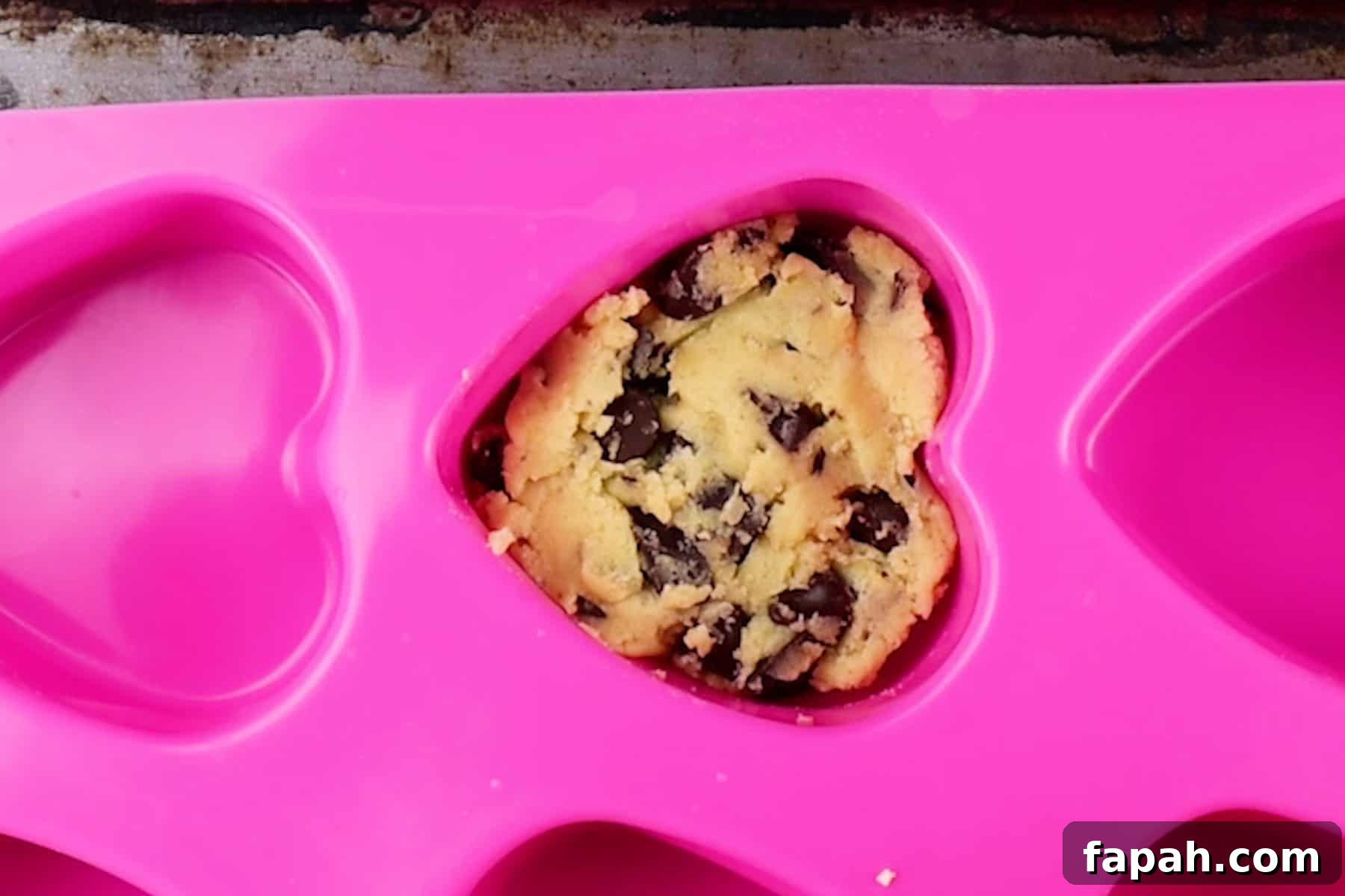 Heart-Shaped Cookies Recipe for Valentine’s Day 7 cookie dough pressed in heart mold.