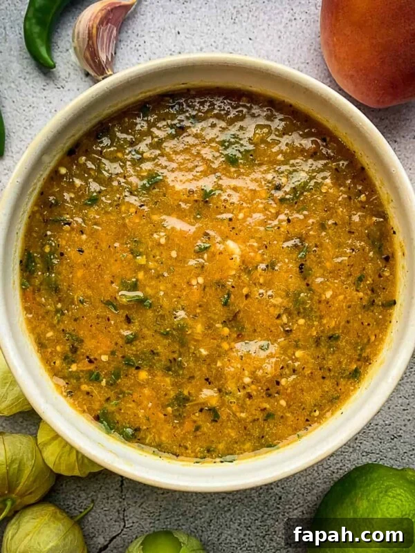 Fresh Cherry Tomato Pico de Gallo Salsa Recipe 12 Peach tomatillo salsa in a bowl surrounded by ingredients.