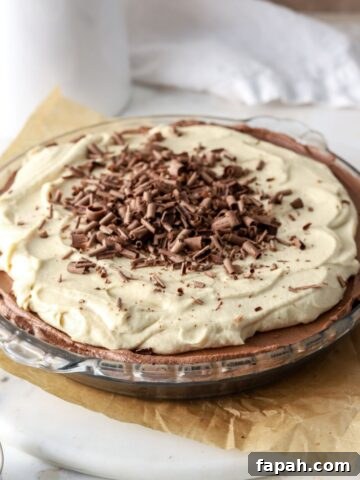 Chocolate pie with peanut butter whipped cream and chocolate shavings.