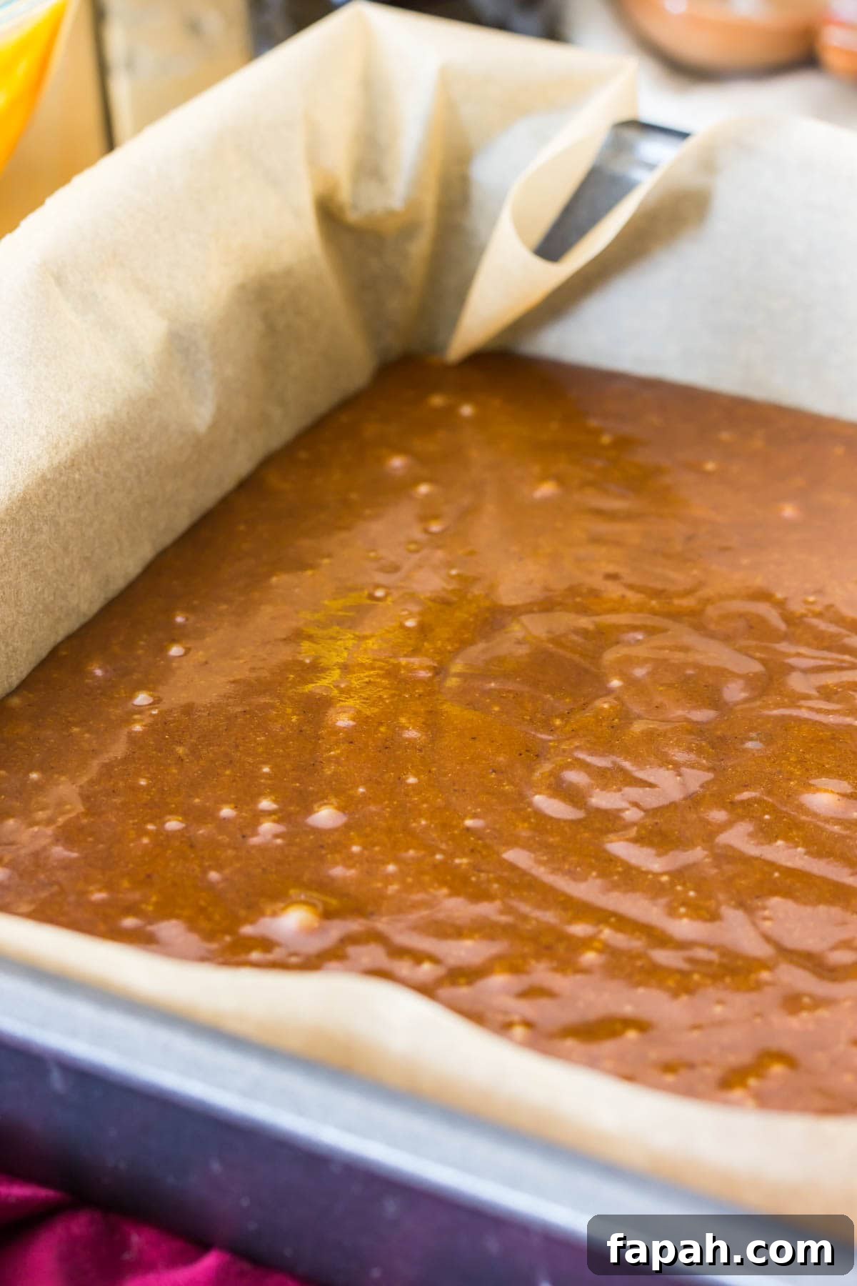 Classic Homemade Gingerbread Recipe for Soft, Spiced Cookies 5 Gingerbread cake batter in metal pan that's been lined with parchment paper