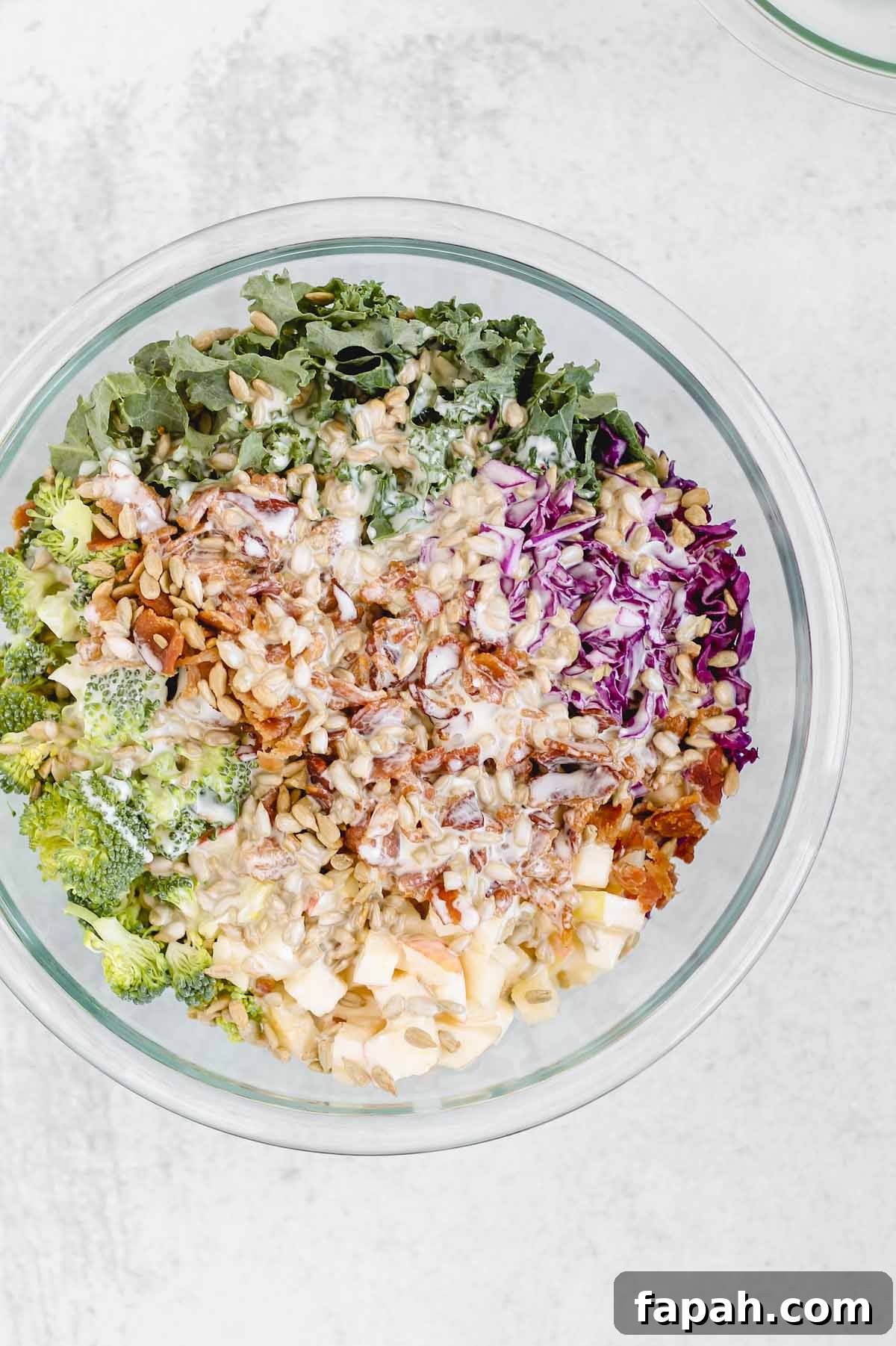broccoli kale salad with dressing poured on top