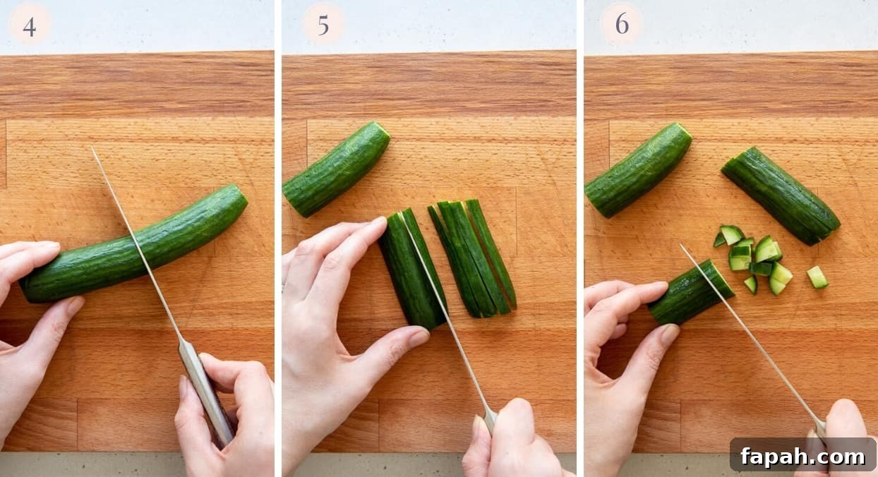 Israeli salad a cucumber being cut into slices, then into fine cubes to make Israeli salad recipe
