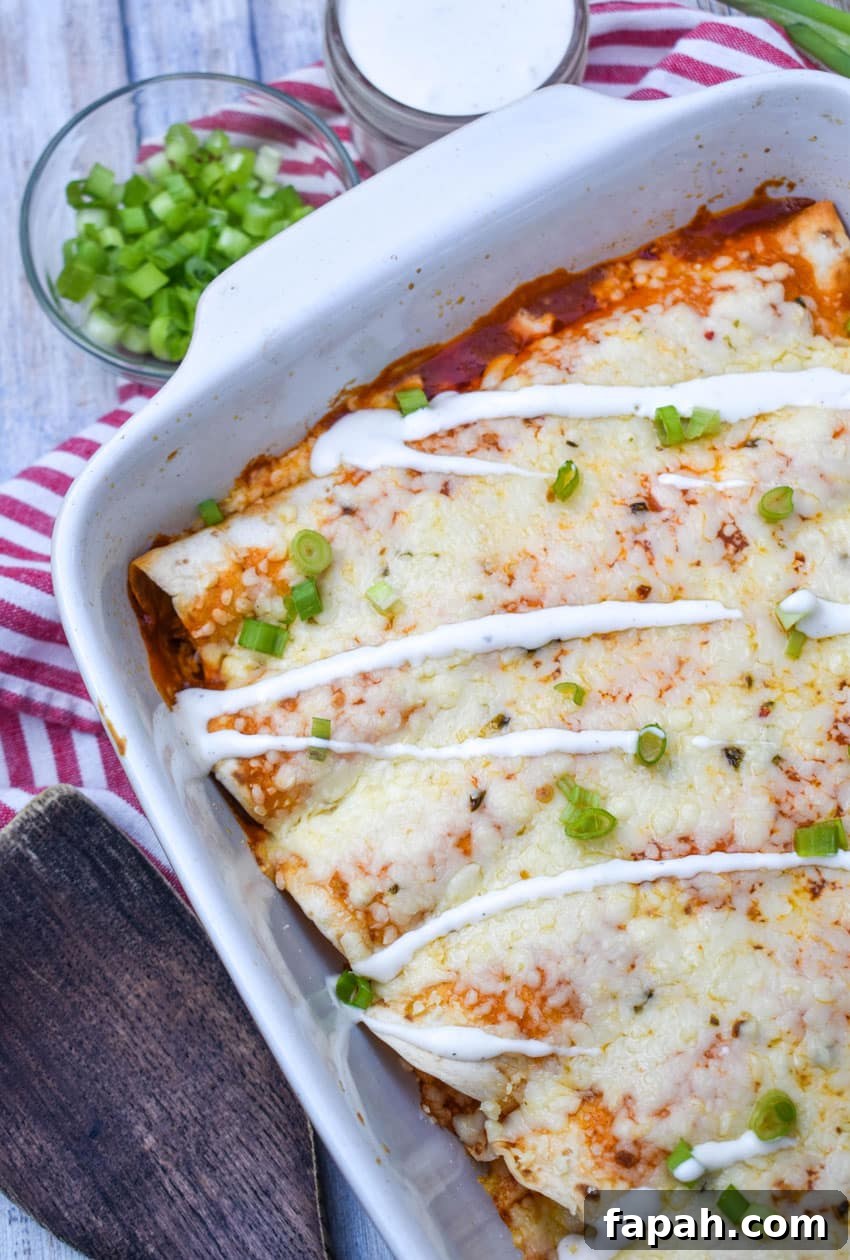 buffalo chicken enchiladas in a white baking dish