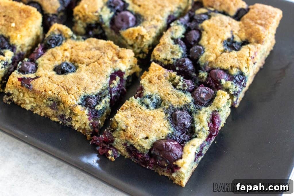 Chewy Blueberry Blondies with Lemon Glaze 11 diagonal shot of blueberry blondie bars on serving platter