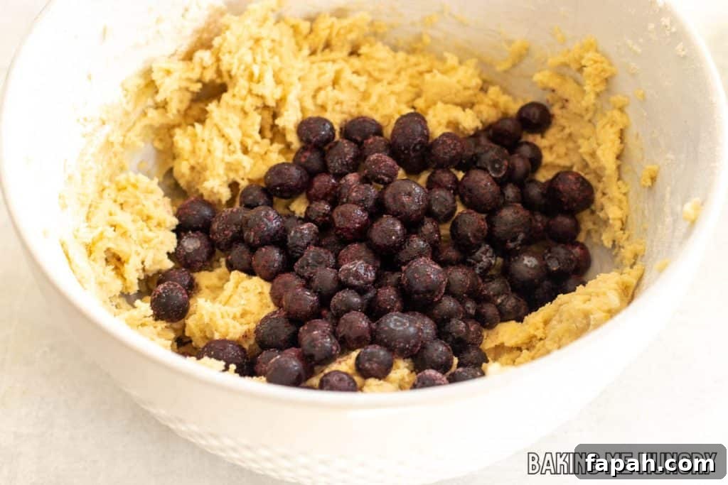 Chewy Blueberry Blondies with Lemon Glaze 8 blueberries added to bowl