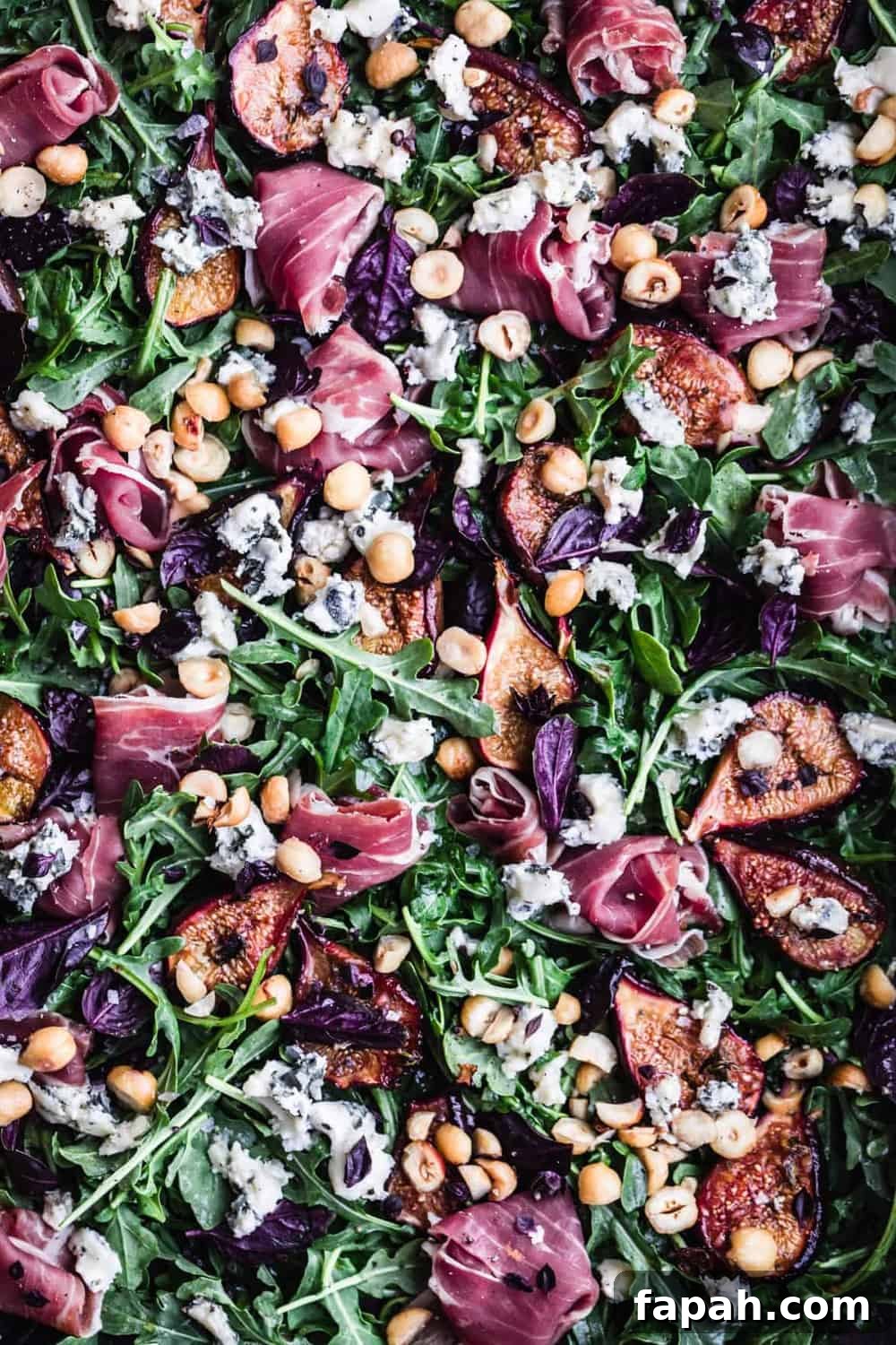 Caramelized fig and prosciutto salad with hazelnuts, basil, blue cheese and arugula.