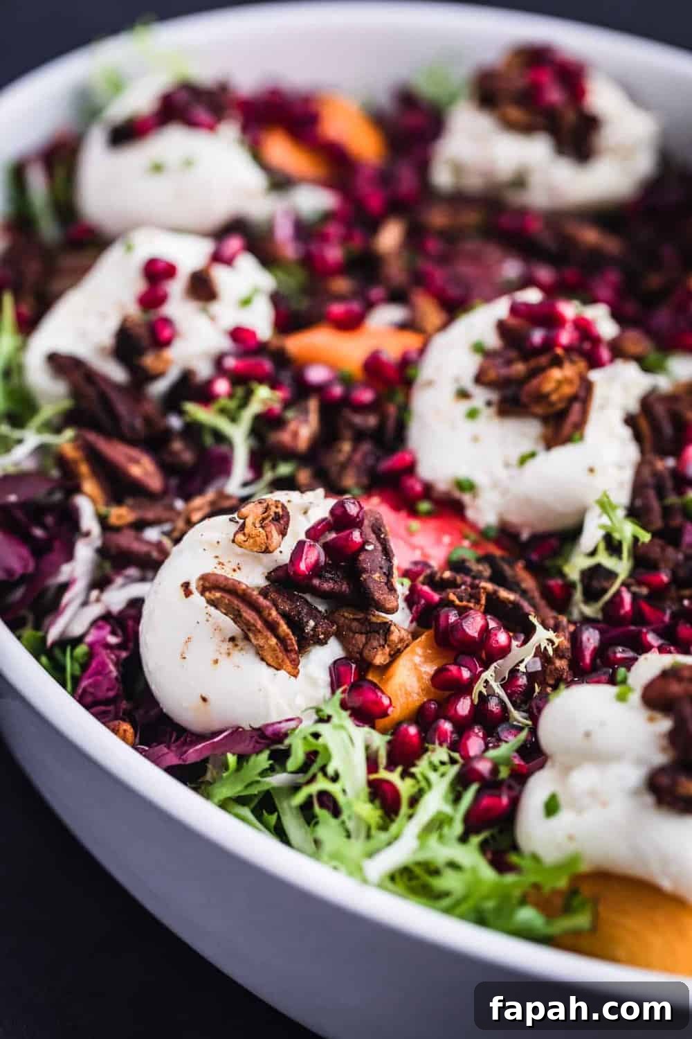 Burrata on frisée and radicchio with pears, persimmons, pomegranate and pecans.