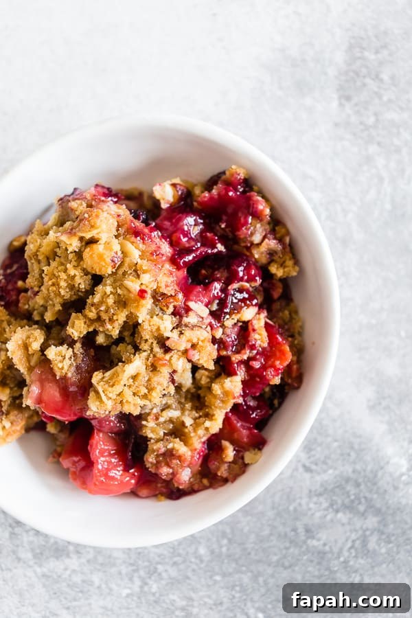 Cardamom Vanilla Plum Crisp with Almond Oat Streusel 2 Cardamom Vanilla Plum Crisp spooned into a bowl.