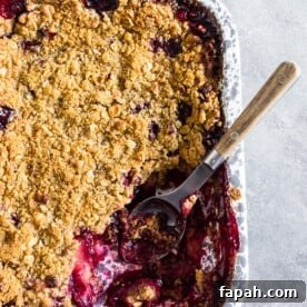 Cardamom Vanilla Plum Crisp with Almond Oat Streusel 9 Cardamom vanilla plum crisp with oat hazelnut topping.