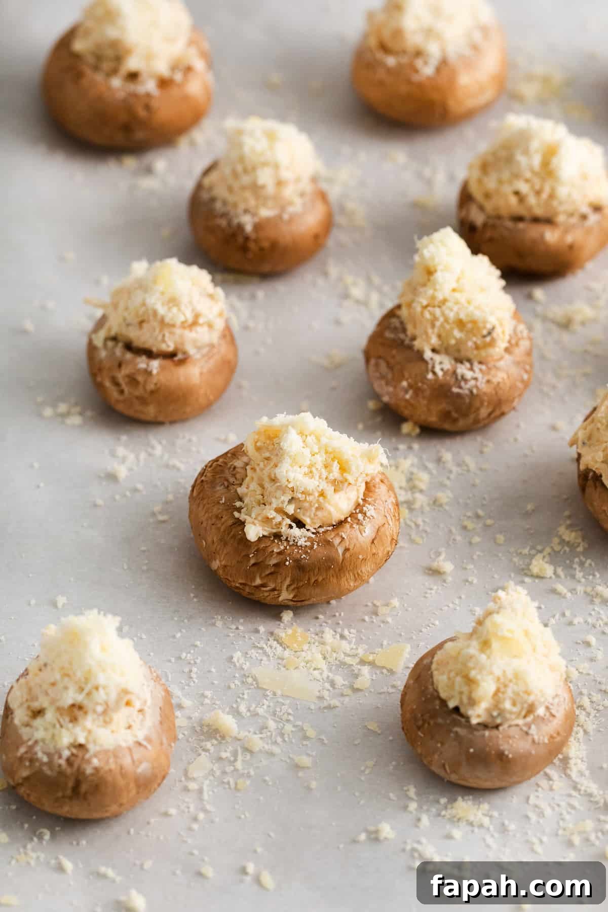 Crab stuffed mushrooms on a baking sheet.