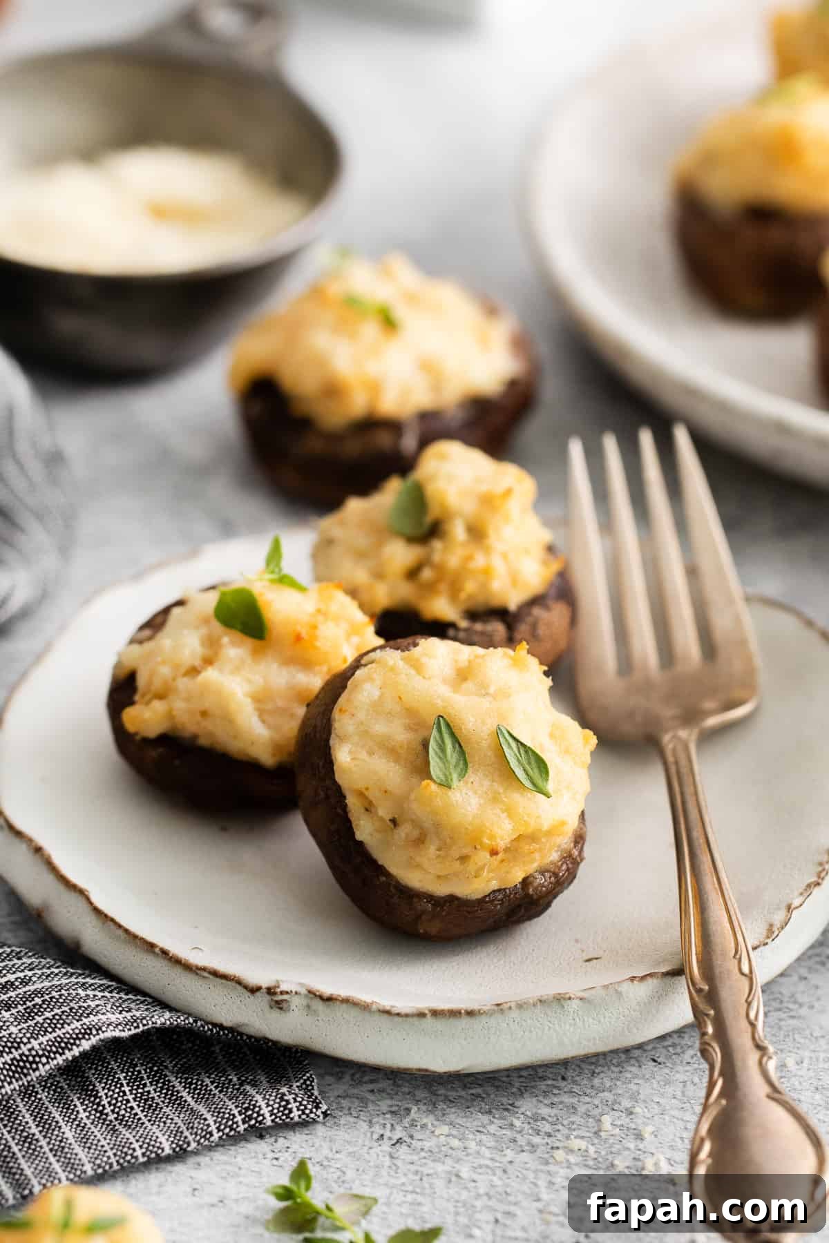 Crab stuffed mushrooms on a plate.