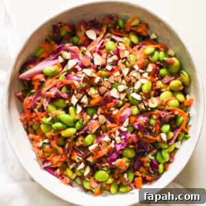 Crisp Edamame Salad with Lemon-Ginger Vinaigrette 10 An overhead shot of a bowl of edamame salad garnished with chopped almonds.