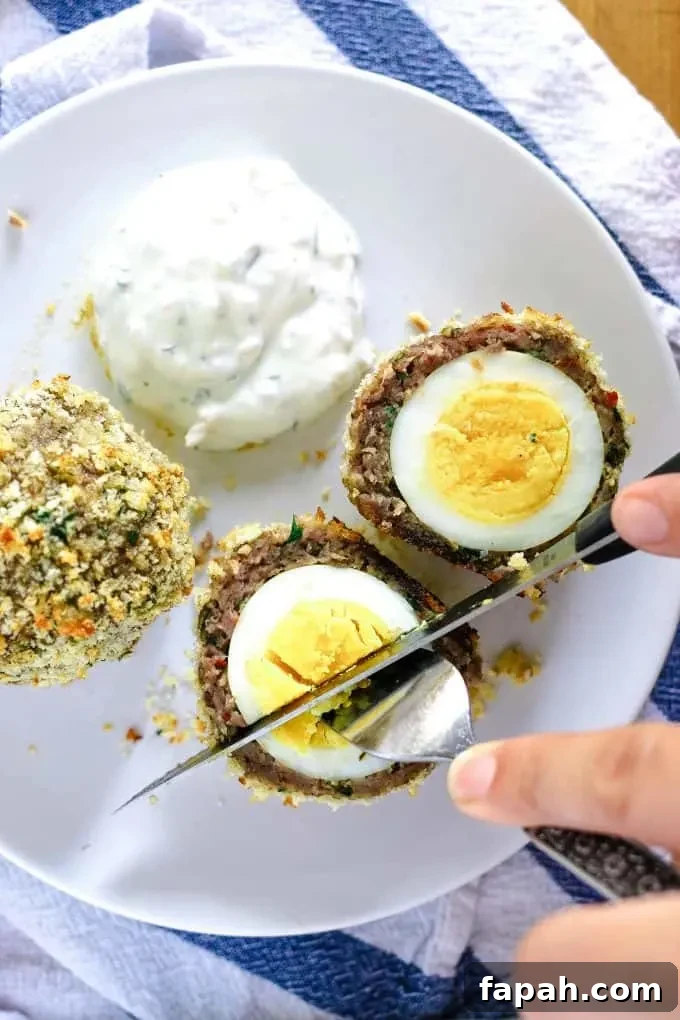 eating a baked scotch egg
