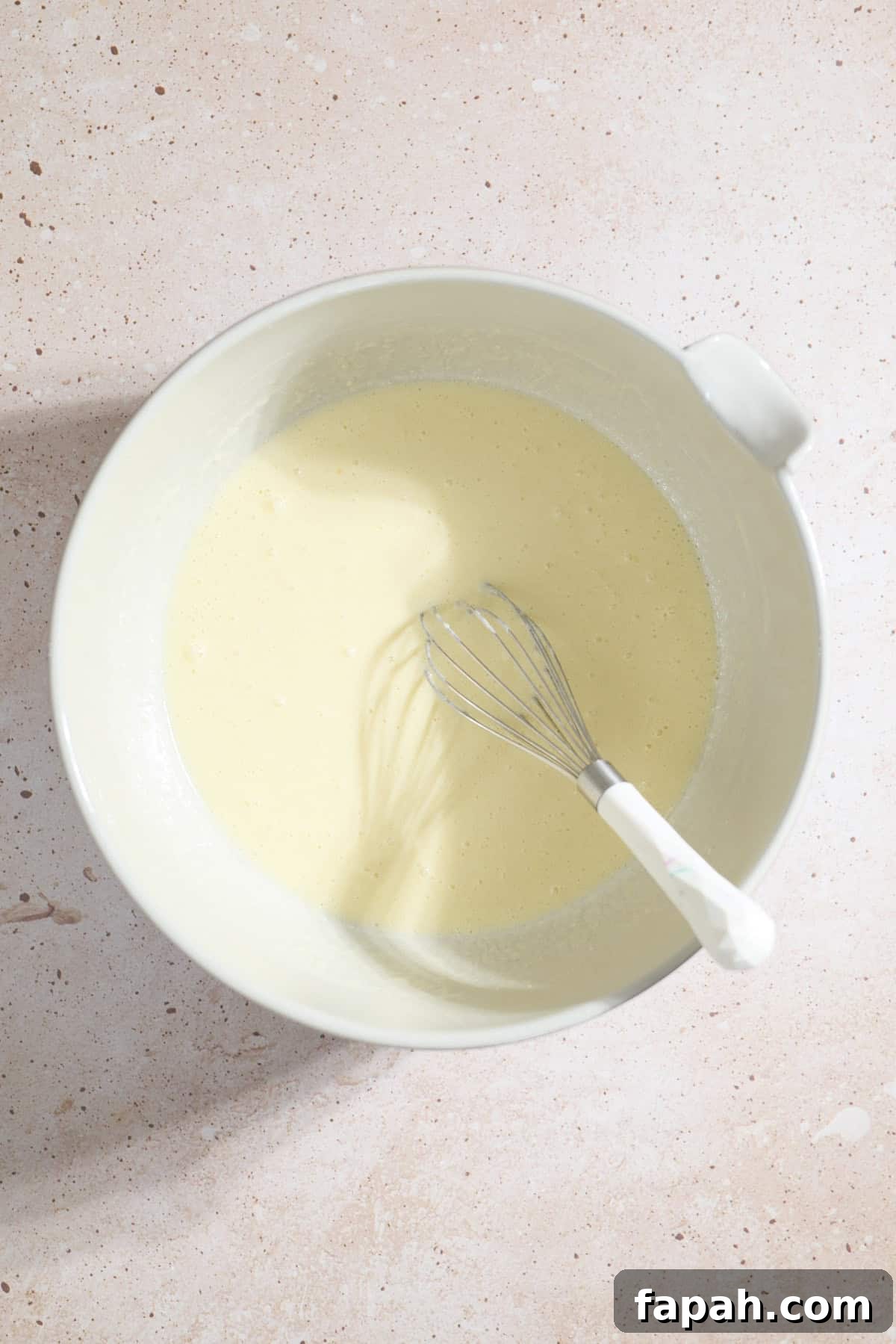 Wet ingredients in a mixing bowl.