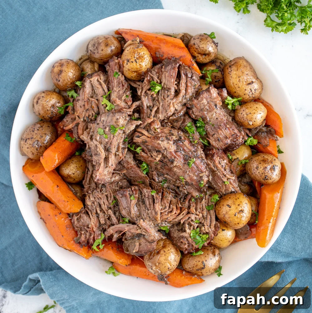 Arugula & Roasted Golden Beet Salad with Citrus Vinaigrette 13 Large white serving bowl filled with carrots, baby potatoes, and juicy pot roast chunks garnished with little specks of parsley.