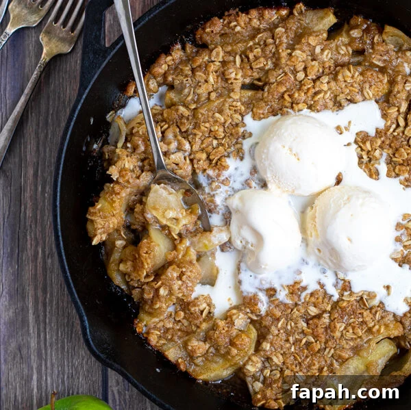 Arugula & Roasted Golden Beet Salad with Citrus Vinaigrette 14 overhead shot of a cast iron on a table filled with apple crisp topped with ice cream and part of it scooped up with a spoon