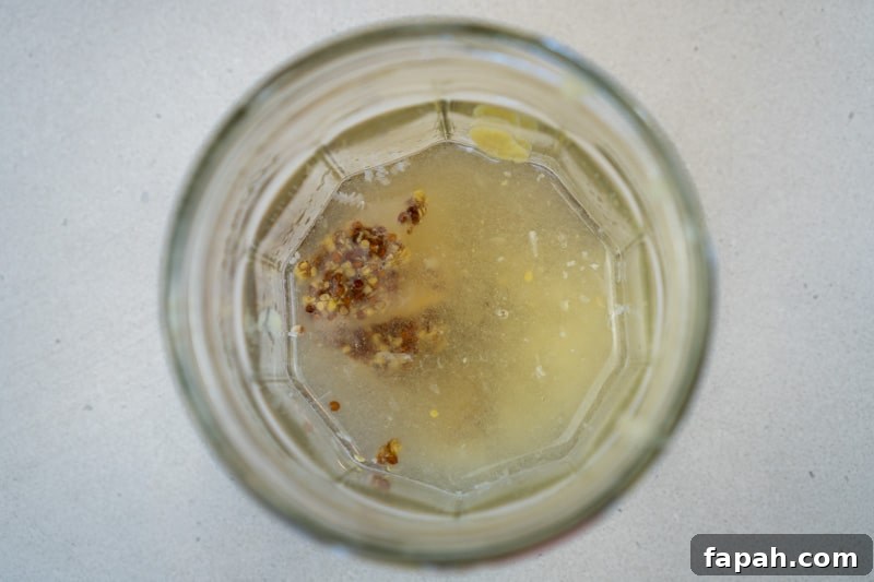 Maple Lemon Vinaigrette Recipe for Bright, Tangy Salads 4 Adding the ingredients to a jar