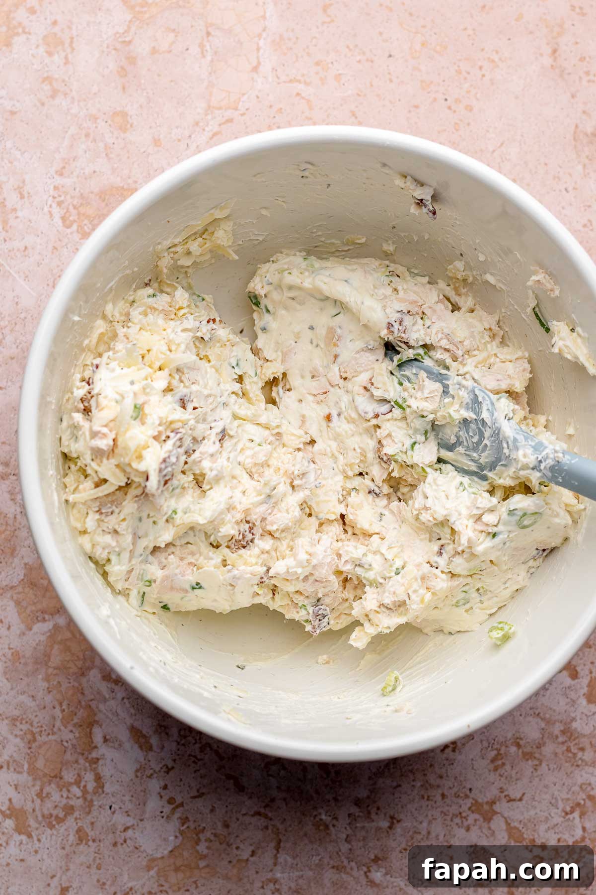 Cheesy Chicken Bacon Ranch Dip — Oven or Crockpot Recipe 5 Chicken bacon ranch dip mixed together in a bowl.