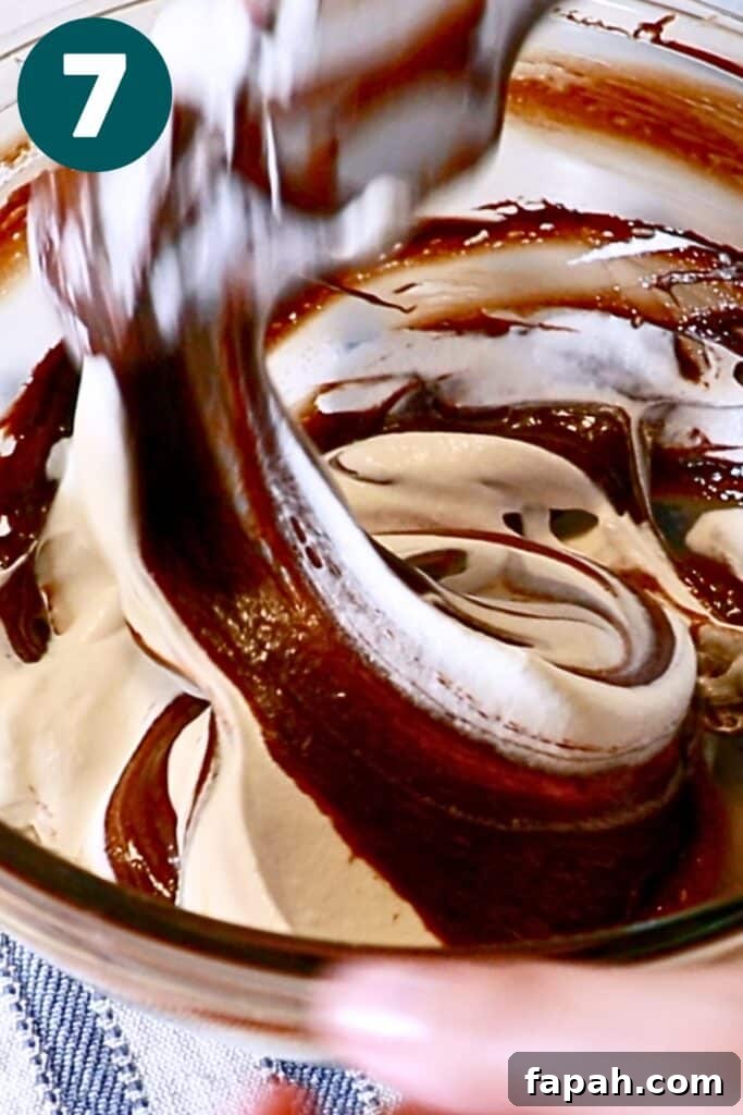 Decadent Chocolate Mousse Recipe for Silky, Airy Dessert 14 folding the chocolate mixture and whipped cream