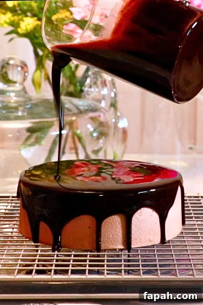 Decadent Chocolate Mousse Recipe for Silky, Airy Dessert 20 pouring mirror glaze on a chocolate mousse cake