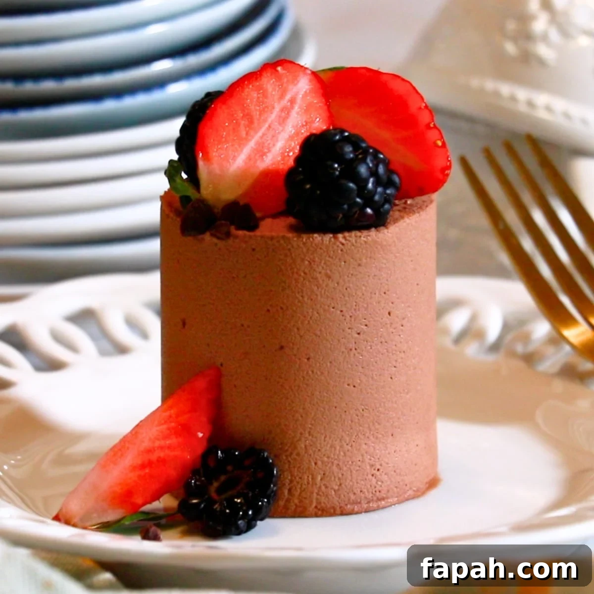 Decadent Chocolate Mousse Recipe for Silky, Airy Dessert 22 a mini chocolate mousse cake on a white plate