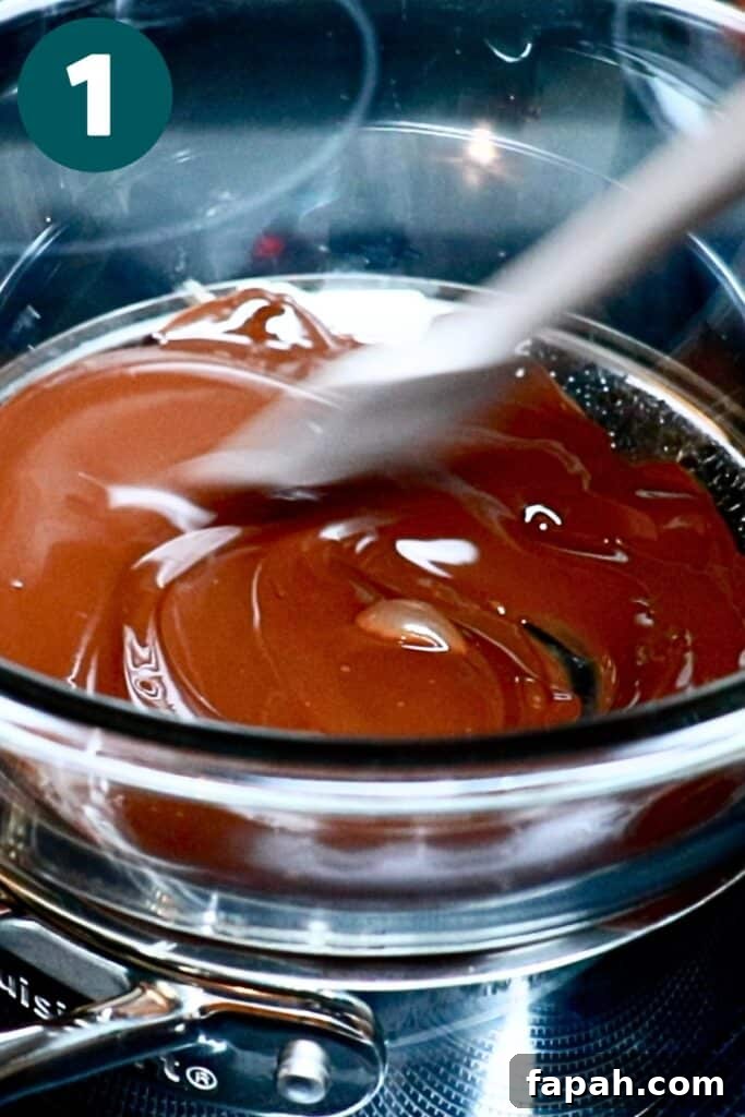 Decadent Chocolate Mousse Recipe for Silky, Airy Dessert 7 melted dark chocolate in a double boiler