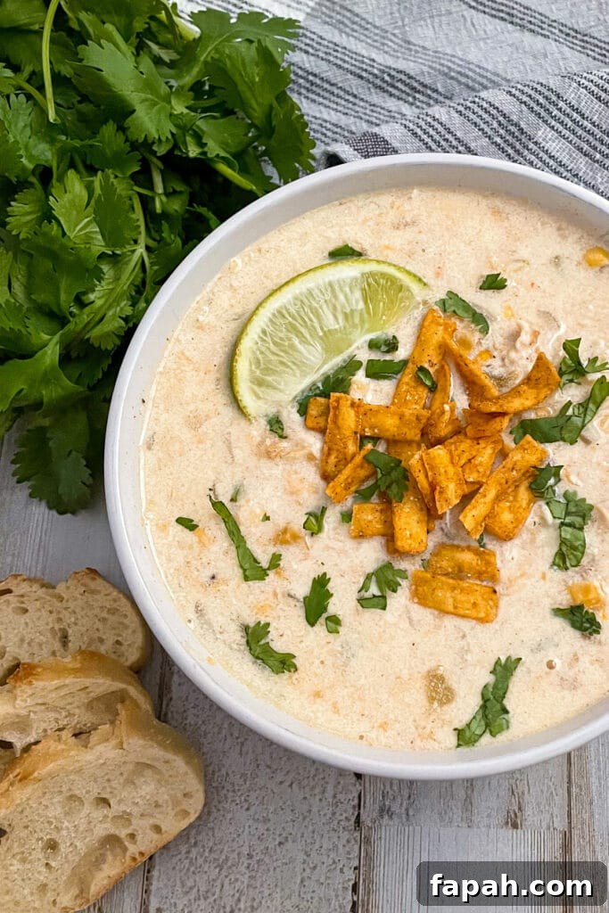 Mexican chicken corn chowder cooked on the stovetop and served with bread slices
