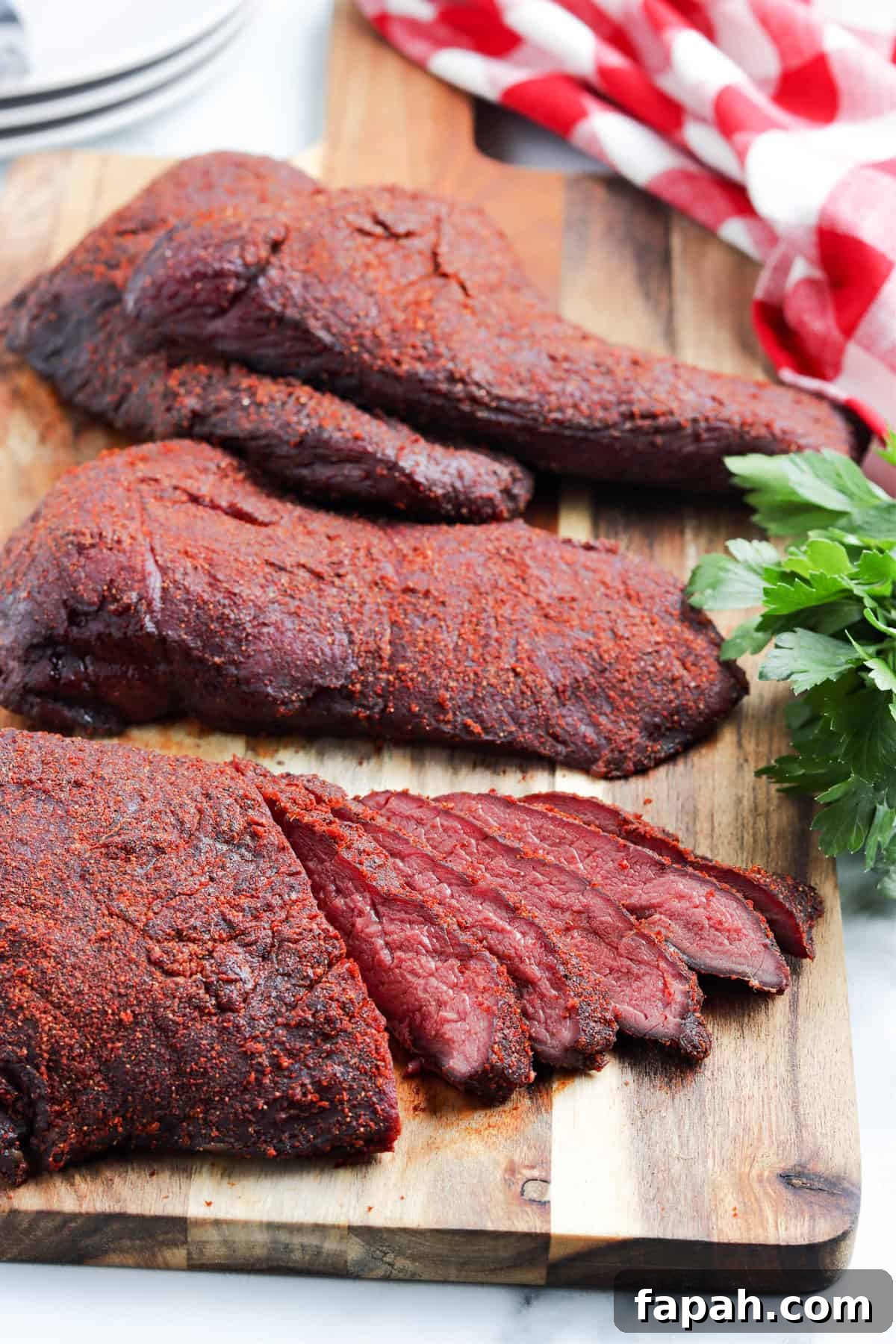 Smoked Venison Roast Recipe Sliced on Cutting Board