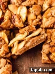 apple pie bar on its side with layers of sliced apples