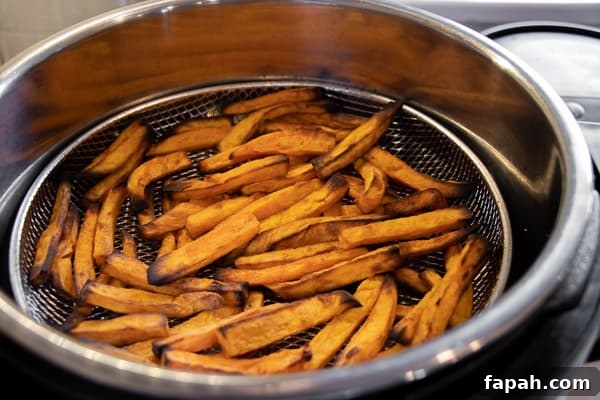 Air Fryer Sweet Potato Fries Recipe - Easy instructions for how to make sweet potato french fries in an air fryer. Crispy and tastes just like deep fried but this recipe uses very little oil. Sweet potatoes make the perfect fries.