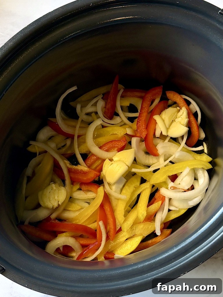 Bell peppers, onions, and garlic in the crockpot