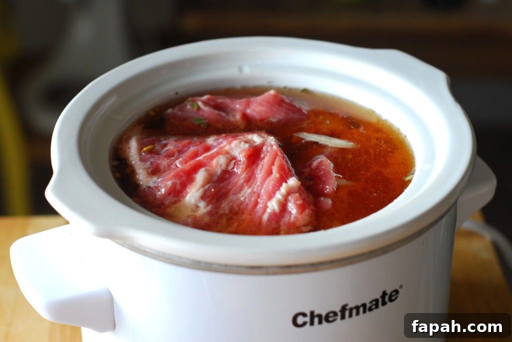 Sous Vide vs Slow Cooker: Which Method Makes Better Meals? 4 Roast in crockpot with liquid.