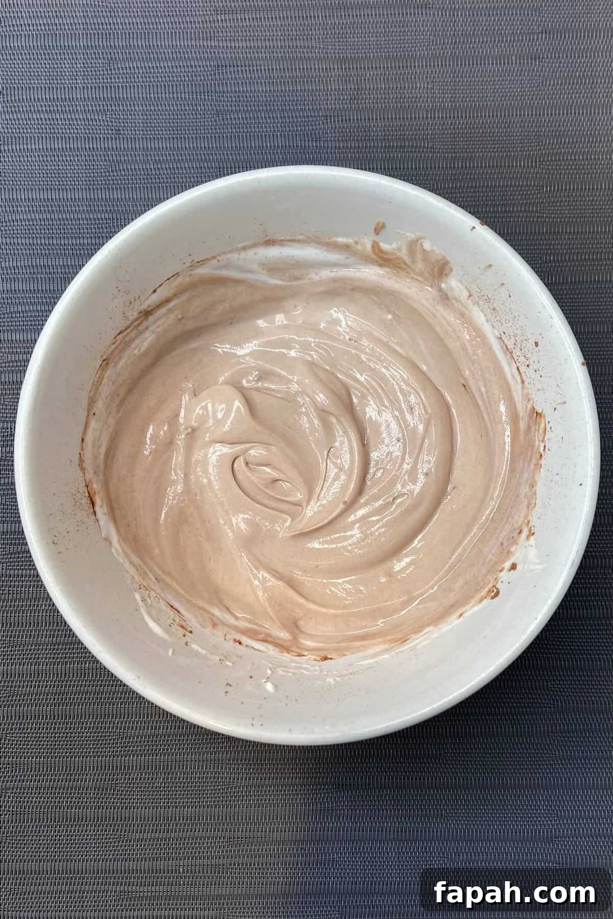 Mixing yogurt and mascarpone.