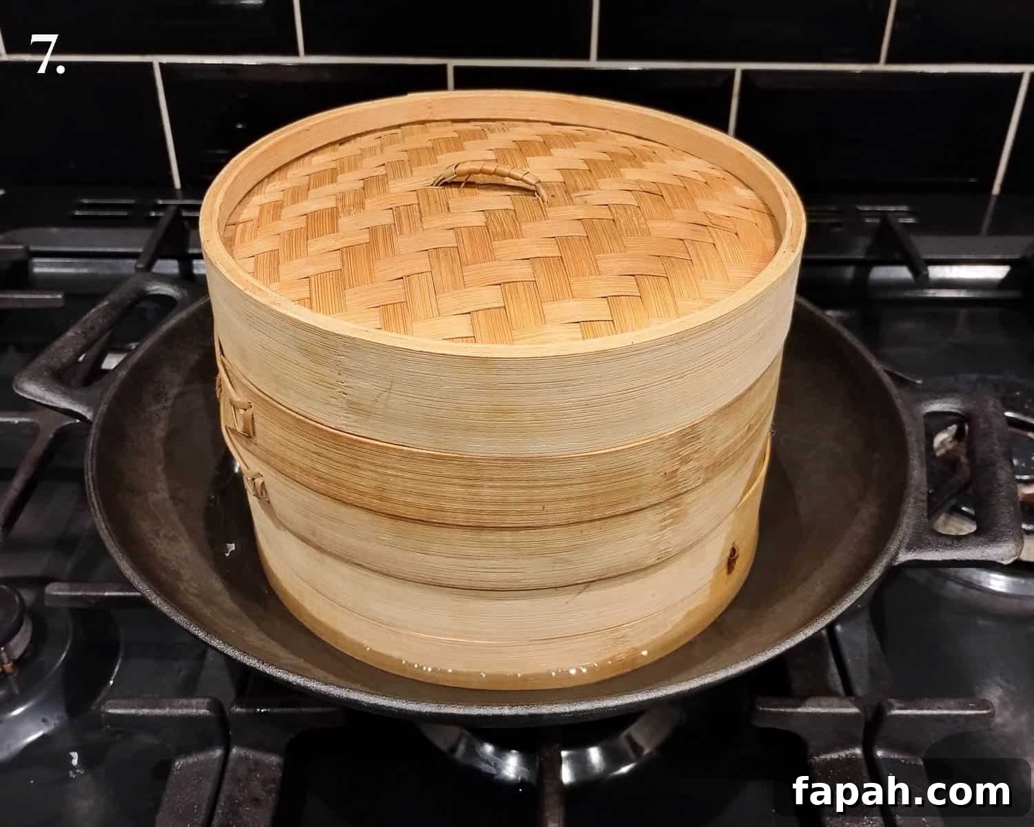 Step 7, the bamboo steamer in a wok.