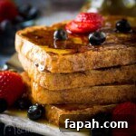 15 Creative Recipes for Using Leftover Bread 15 Stacked french toast covered in syrup