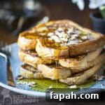 15 Creative Recipes for Using Leftover Bread 17 Stack of french toast with syrup and chopped almonds