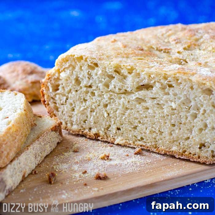 15 Creative Recipes for Using Leftover Bread 27 freshly made bread on a cutting board with two slices to the side