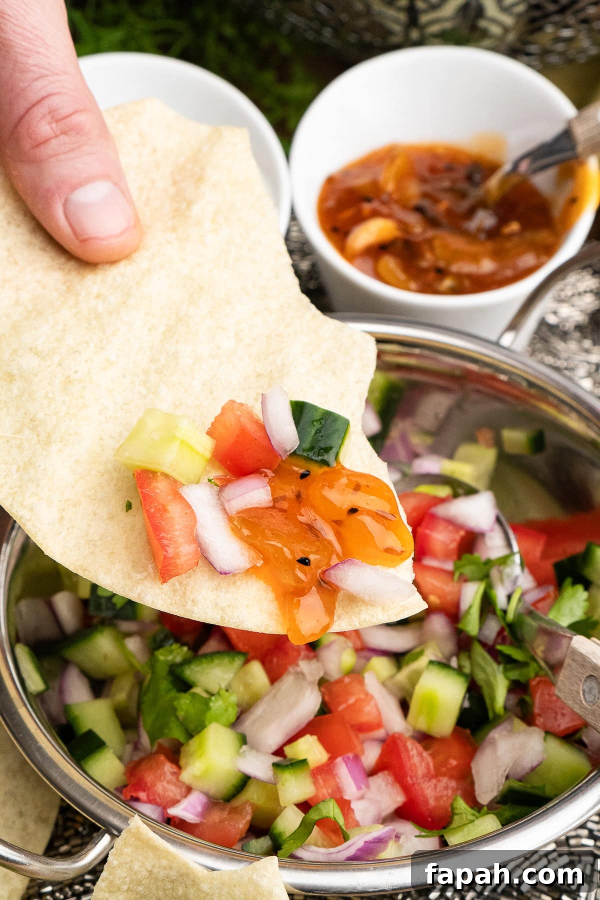 Indian Onion Salad with mango chutney on a poppadom