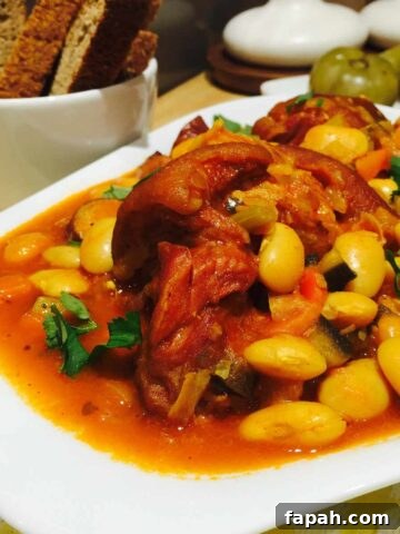 Smoked pork joint, sausages and butterbeans stew