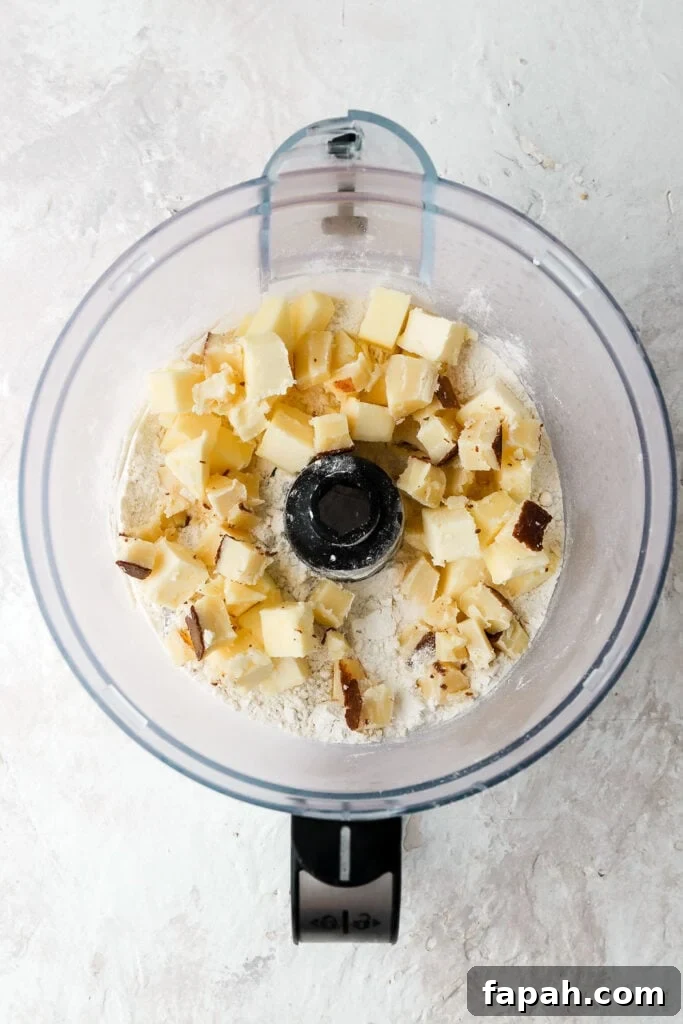 add cold cubed butter to food processor