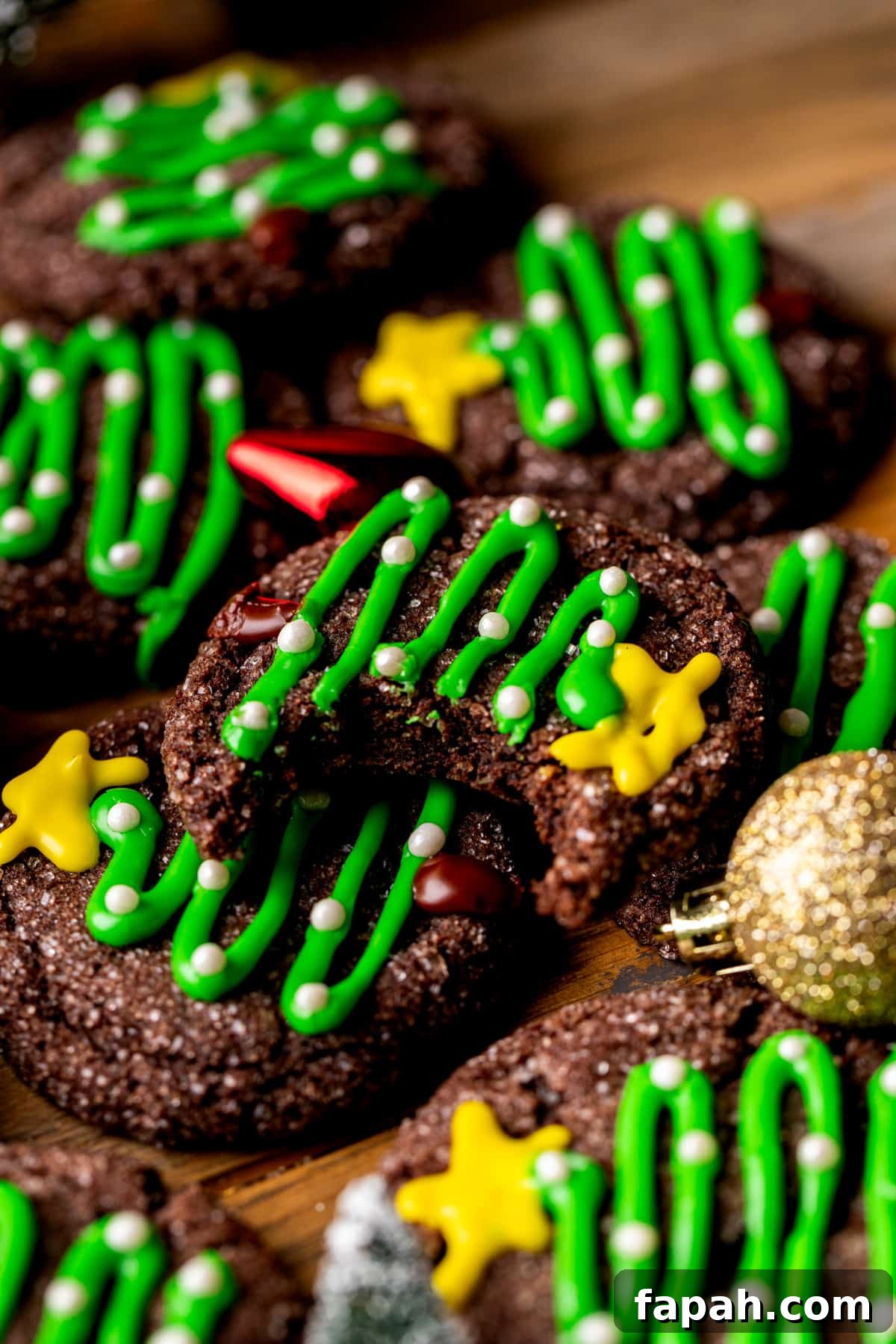 Festive Christmas Tree Cookie Recipes for Holiday Baking 13 Bite missing from cookie.